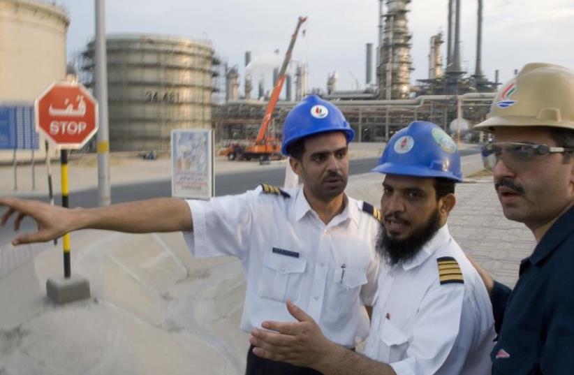 Employess of Kuwait National Petroleum Co. (file) (photo credit: REUTERS)