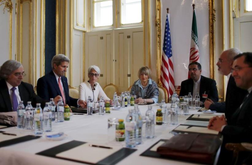 US Secretary of Energy Ernest Moniz, US Secretary of State John Kerry and U.S. Under Secretary for Political Affairs Wendy Sherman (L-3rd L) meet with Iranian Foreign Minister Mohammad Javad Zarif (2nd R) at a hotel in Vienna, Austria June 27, 2015. (photo credit: REUTERS)