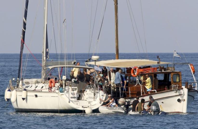Activists aboard a flotilla to Gaza. (photo credit: REUTERS)