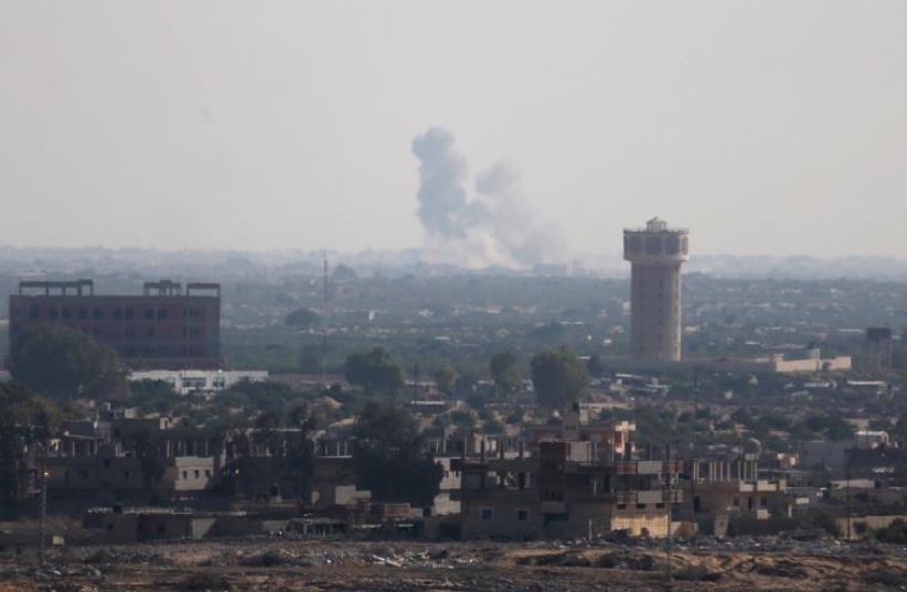 Smoke rises in Egypt's North Sinai as seen from the border of southern Gaza Strip with Egypt July 1, 2015.  (photo credit: REUTERS)