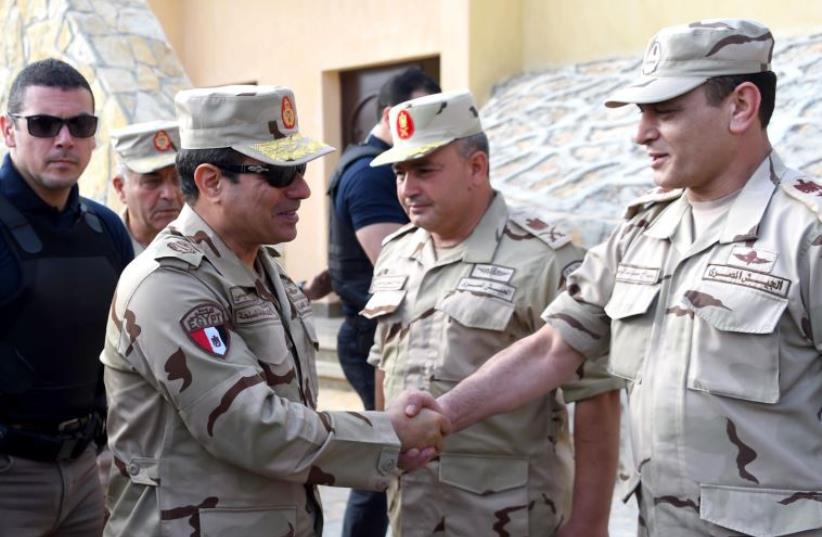 Al-Sisi in uniform making trip to Sinai (photo credit: MOHAMED ABDELMOATY / EGYPTIAN PRESIDENCY / AFP)