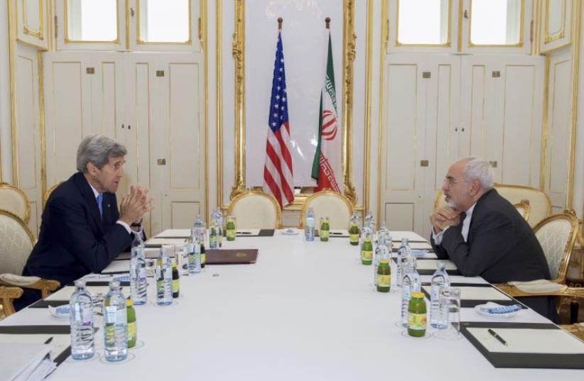 IRAN-NUCLEAR/ RTX1IHEE 30 Jun. 2015 Vienna, Austria U.S. Secretary of State John Kerry (L) meets with Iranian Foreign Minister Javad Zarif at a hotel in Vienna, Austria June 30, 2015. (file) (photo credit: REUTERS)