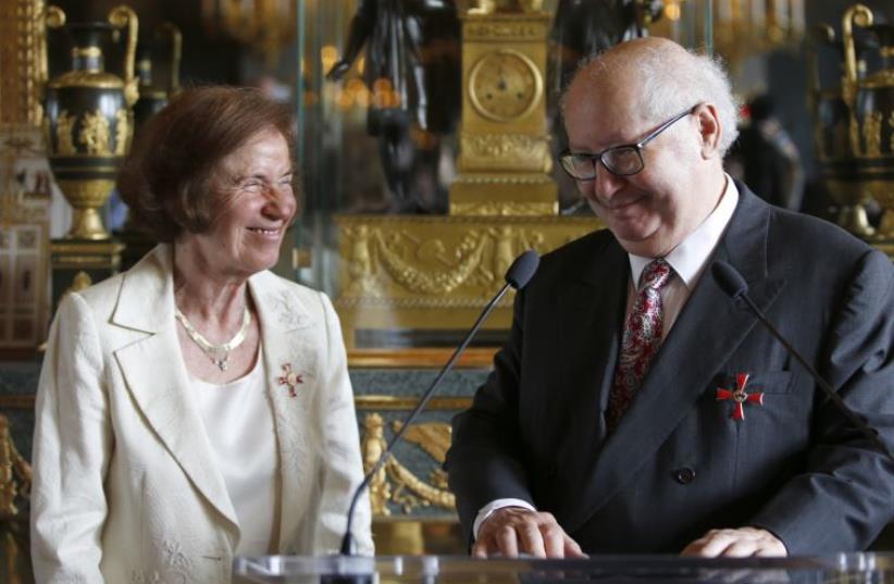 Nazi hunters Beate Klarsfeld and her husband Serge Klarsfeld react after being awarded by German ambassador (photo credit: REUTERS)
