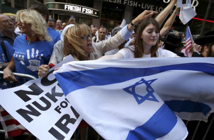 Protestors shout slogans as they demonstrate with thousands of others during a rally apposing the nuclear deal with Iran in New York (photo credit: REUTERS)