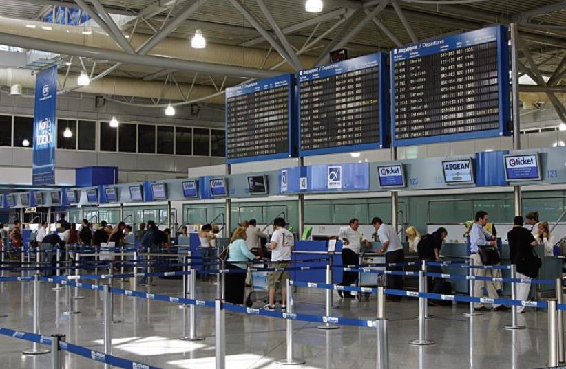 Checking in at the airport in Athens (photo credit: Wikimedia Commons)
