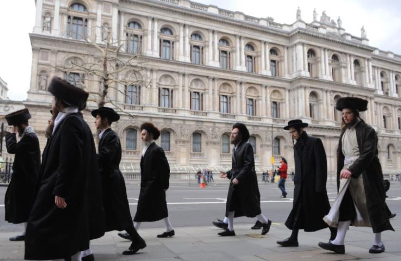 Orthodox Jews walk along Whitehall in central London (photo credit: REUTERS)