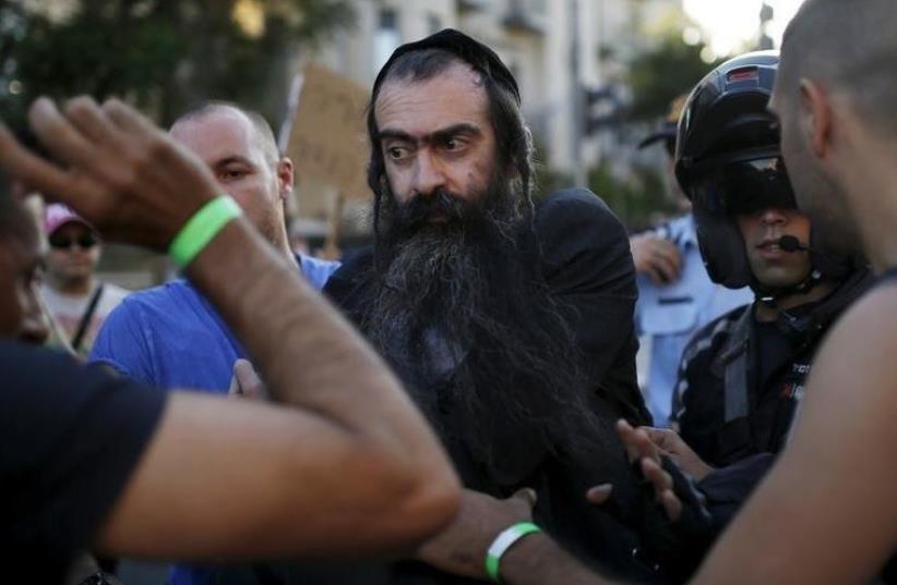 Yishai Schlissel arrested after stabbing six people at the Jerusalem gay pride parade (photo credit: REUTERS)