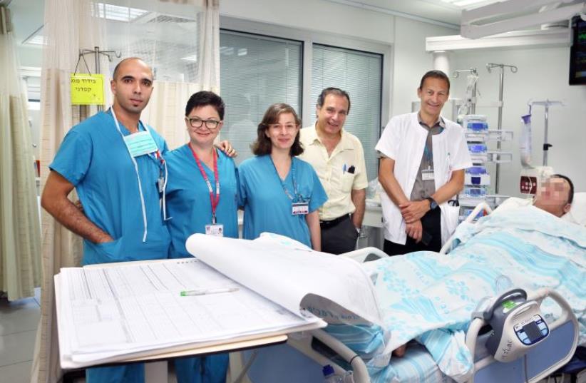 Prof. Bolotin (R) and team treating Palestinian team at Rambam Medical Center (photo credit: COURTESY RAMBAM MEDICAL CENTER)