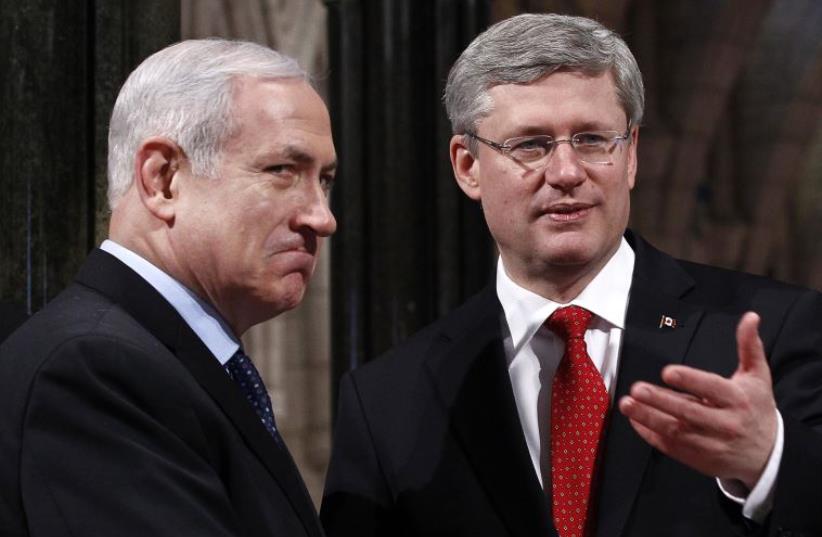 Canada's Prime Minister Stephen Harper (R) shakes hands with Prime Minister Benjamin Netanyahu in Ottawa (photo credit: REUTERS)