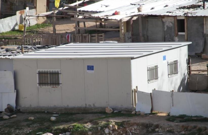 EU funded structure in a Palestinian Beduin encampment outside of the Ma'aleh Adumim settlement in the West Bank. (photo credit: TOVAH LAZAROFF)