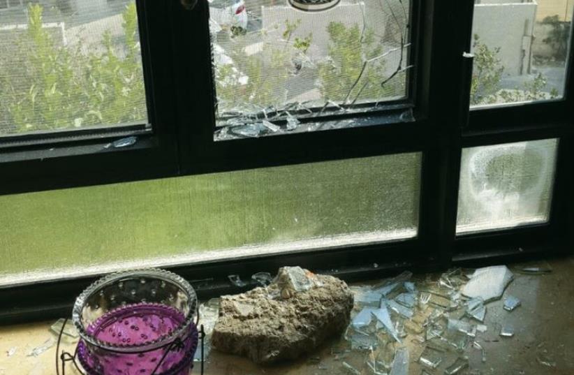 Rock-throwing shatters a window in an East Talpiot home. (photo credit: GIL SCHECHTER)