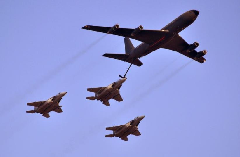 A Boeing 707 aerially refuels three F-15 Eagles (photo credit: YONATAN ZALK / IAF)