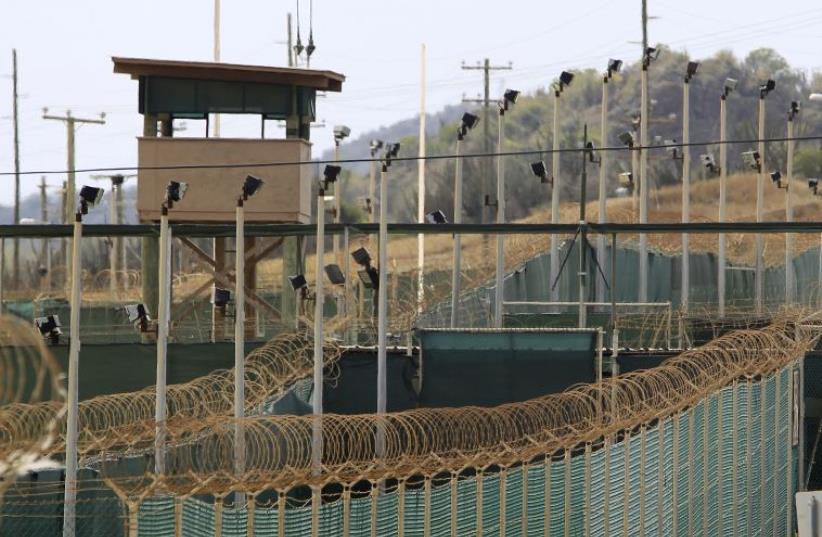 The exterior of Camp Delta is seen at the U.S. Naval Base at Guantanamo Bay, March 6, 2013. The facility is operated by the Joint Task Force Guantanamo and holds prisoners who have been captured in the war in Afghanistan and elsewhere since the September 11, 2001 attacks.  (photo credit: REUTERS)