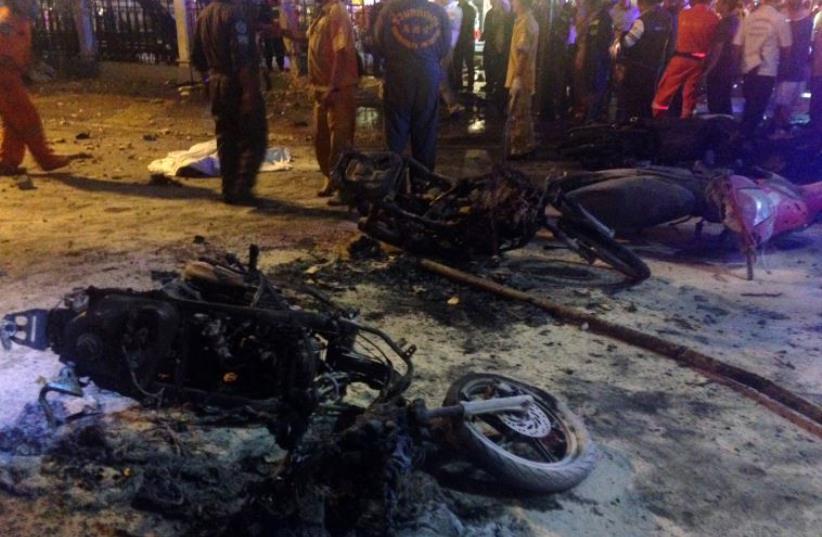Destroyed motorbikes are pictured at the scene of devastation after a bomb exploded outside a religious shrine in central Bangkok late on August 17, 2015 (photo credit: AIDAN JONES / AFP)