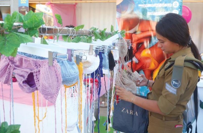 Browsing for a bathing suit (photo credit: MARC ISRAEL SELLEM/THE JERUSALEM POST)