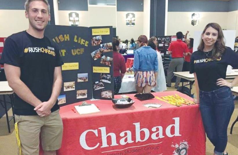 JEWISH STUDENTS man the Chabad table at the University of Central Florida recently. ( (photo credit: CHABAD.ORG)