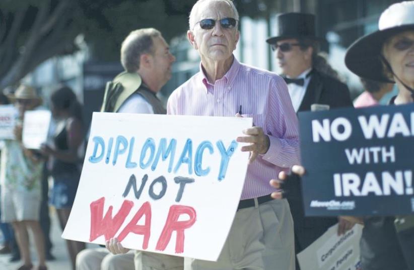 PEOPLE DEMONSTRATE in favor of the Iran nuclear deal in Los Angeles on Wednesday (photo credit: REUTERS)
