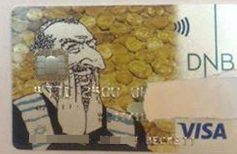 An anti-Semetic credit card features a hook-nosed Jew, laughing gleefully against a backdrop of gold coins  (photo credit: Courtesy)