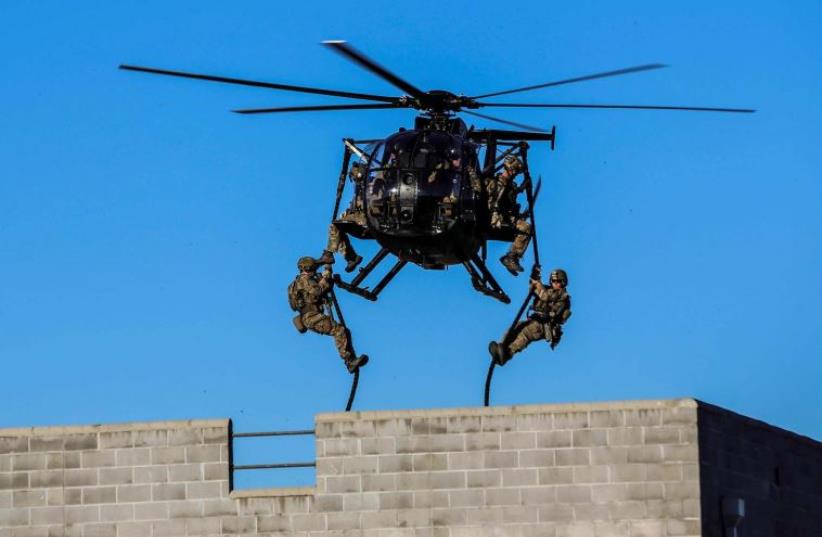 US special forces in action (photo credit: COURTESY USASOC)