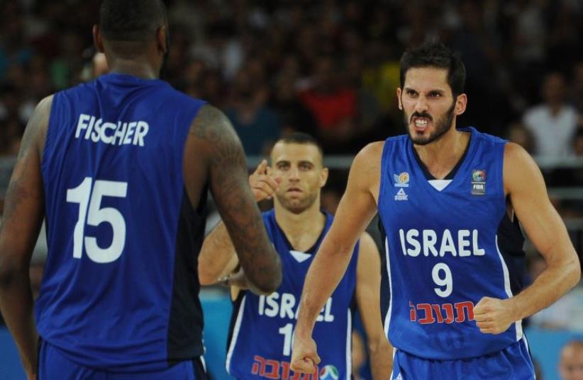 Israel's Omri Casspi (R) reacts during the group A qualification basketball match between Finland and Israel at the Euro Basket 2015 in Montpellier on September 6 2015.  (photo credit: AFP PHOTO / SYLVAIN THOMAS)