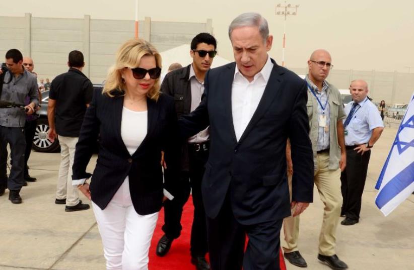Benjamin and Sara Netanyahu at Ben Gurion Airport (photo credit: PRIME MINISTER'S OFFICE)