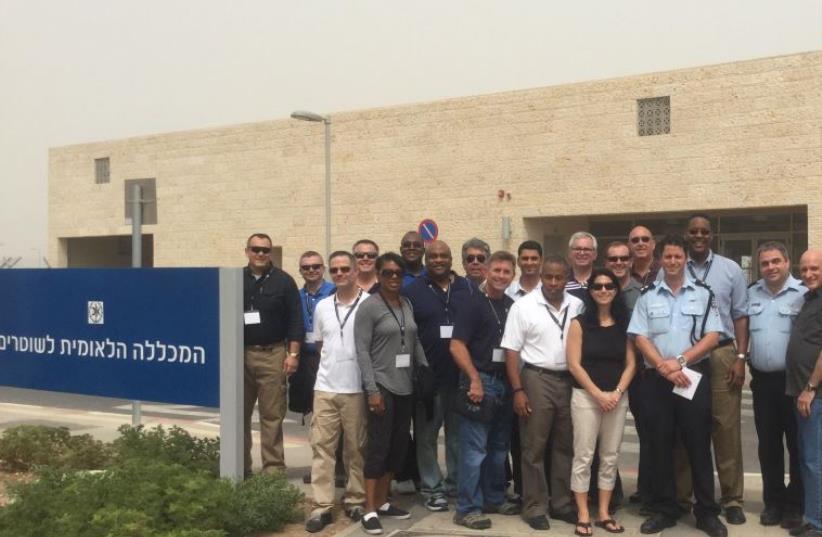American law-enforcment delegates stand next to their Israeli counterparts at Israel's National Police Academy (photo credit: BEN HARTMAN)