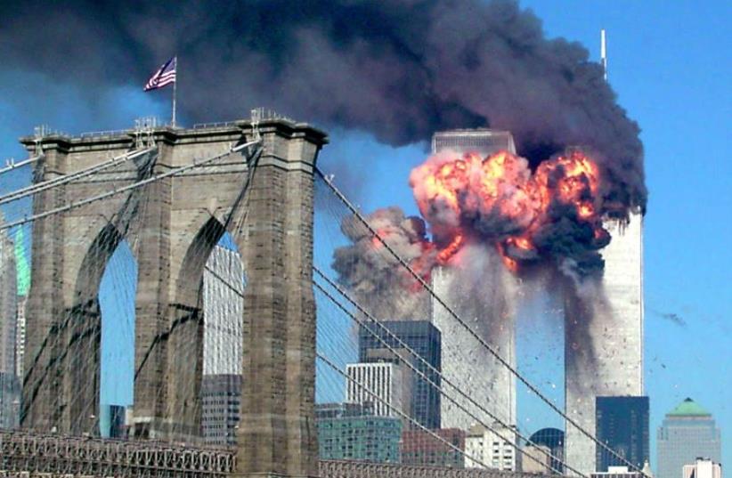 The second tower of the World Trade Center bursts into flames after being hit by a hijacked airplane in New York on September 11, 2001. (photo credit: REUTERS)