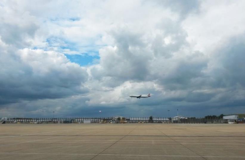 A BRITISH AIRWAYS flight lands at Heathrow Airport (photo credit: AMY SPIRO)