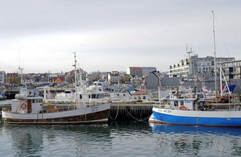 Fishermen's boats are seen docked at the Reykjavik harbour in Iceland March 24, 2015. (photo credit: REUTERS)