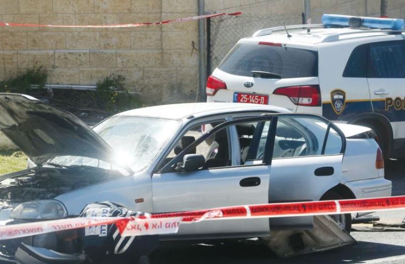 Illustrative photo of police at a crime scene (photo credit: MARC ISRAEL SELLEM/THE JERUSALEM POST)