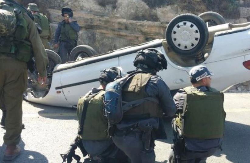 THE TERRORIST driver of this car ran down and wounded two soldiers on Route 60 in August, before he was shot and lost control of the car, which overturned (photo credit: TAZPIT)