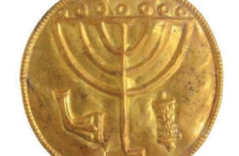 A 10 CM. medallion recently discovered at the foot of the Temple Mount with a menorah etched inside (photo credit: HEBREW UNIVERSITY)