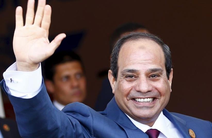 Egyptian President Abdel Fattah al-Sisi waves as he arrives to the opening ceremony of the New Suez Canal (photo credit: REUTERS)