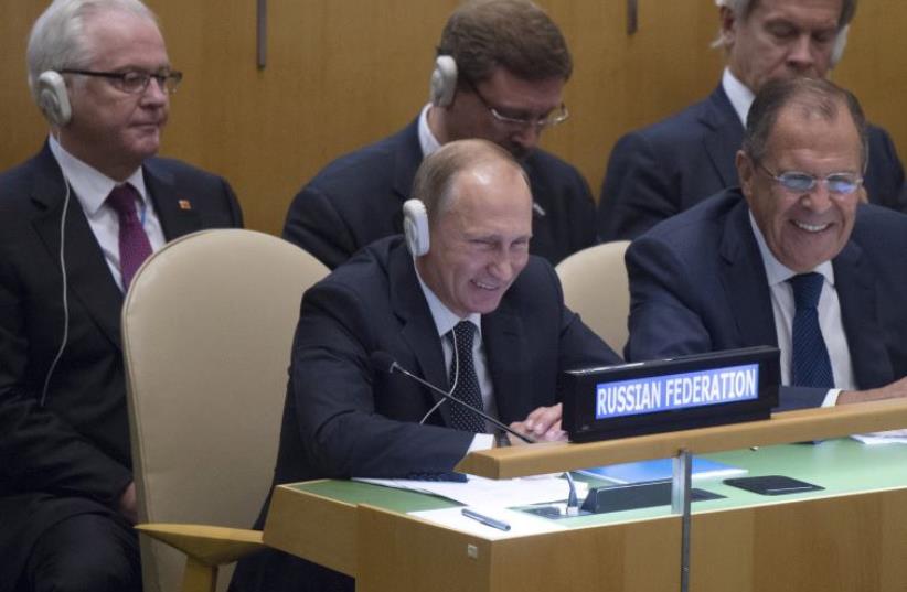Russian President Vladimir Putin (L, front), Foreign Minister Sergei Lavrov (R, front), and members of the Russian delegation at the UNGA, September 28, 2015. (photo credit: REUTERS)
