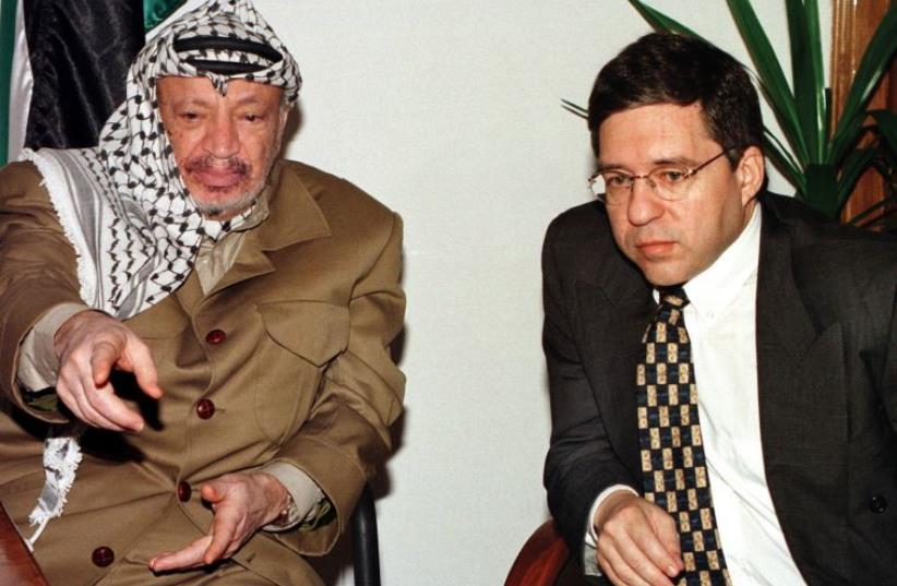Oslo Accords architect Yossi Beilin meets Palestinian Authority president Yasser Arafat in Jericho, in 1997 (photo credit: REUTERS)