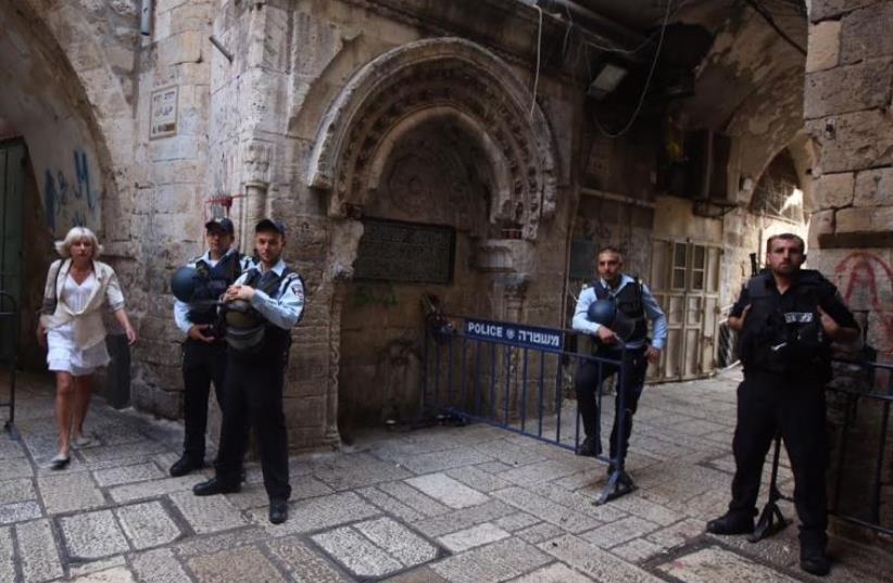 Police at a security barricade in the Old City of Jerusalem (photo credit: MARC ISRAEL SELLEM)