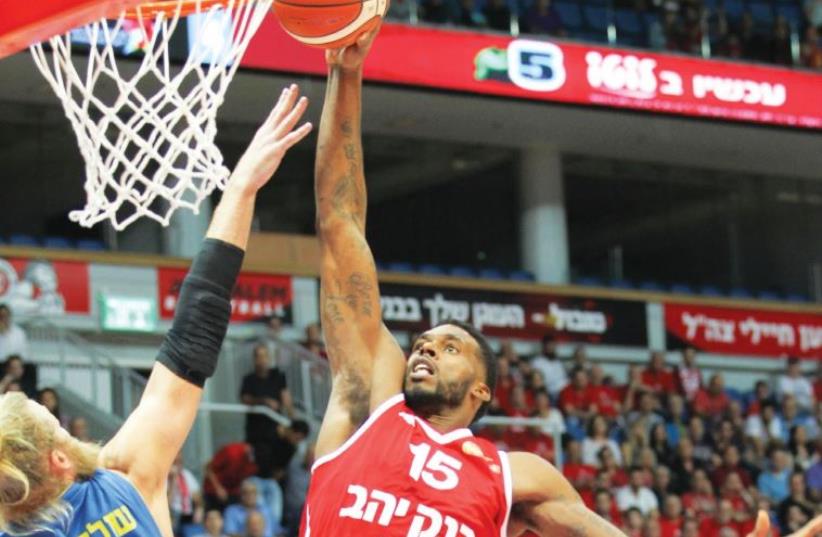 Hapoel Jerusalem forward Donta Smith goes up for a dunk in a game against Maccabi Ashdod (photo credit: DANNY MARON)