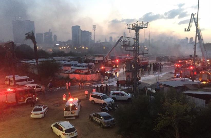 Firefighters control blaze at Dan bus company parking lot (photo credit: ALONI MOR)