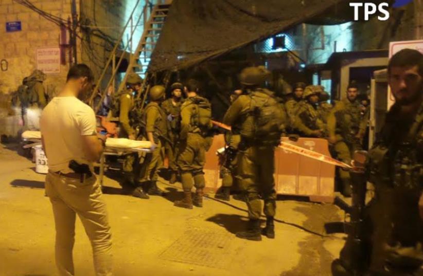Terrorst stabbing in Hebron (photo credit: TAZPIT)