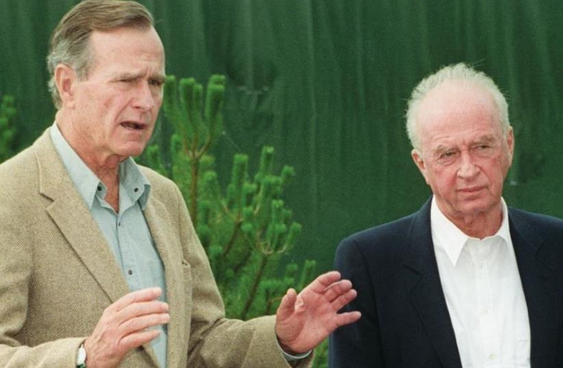 PM Yitzhak Rabin and president George Bush Sr. speak to the press at Bush’s seaside retreat in Maine on August 10, 1992 (photo credit: WIN MCNAMEE/REUTERS)