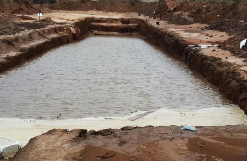Water floods 1,500-year-old winepress unearthed in area once known for wine production‏ (photo credit: Israel Antiquities Authority)
