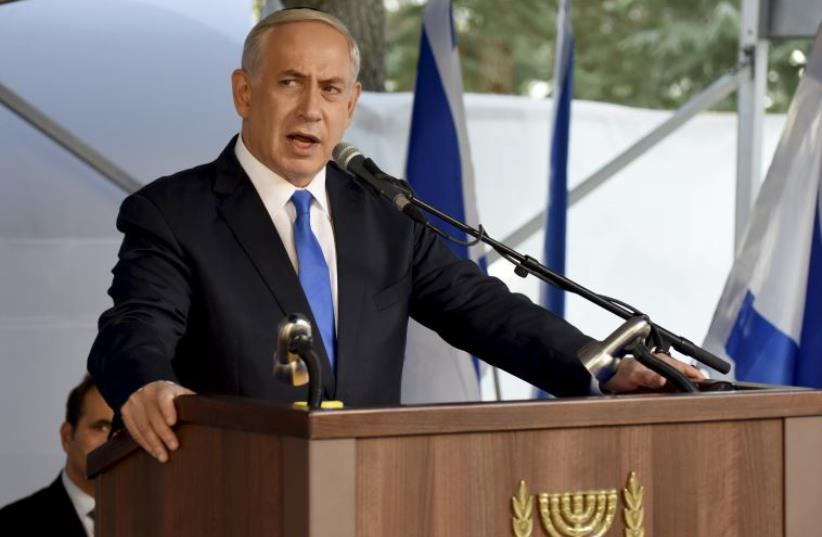 Prime Minister Benjamin Netanyahu delivers a speech during a memorial ceremony for the late Yitzhak Rabin at Mount Herzl military cemetery in Jerusalem (photo credit: REUTERS)