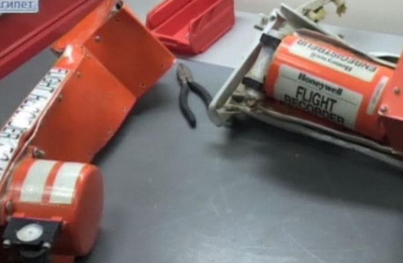 Russian TV shows still of black boxes from plane crashed in Egypt (photo credit: REUTERS)
