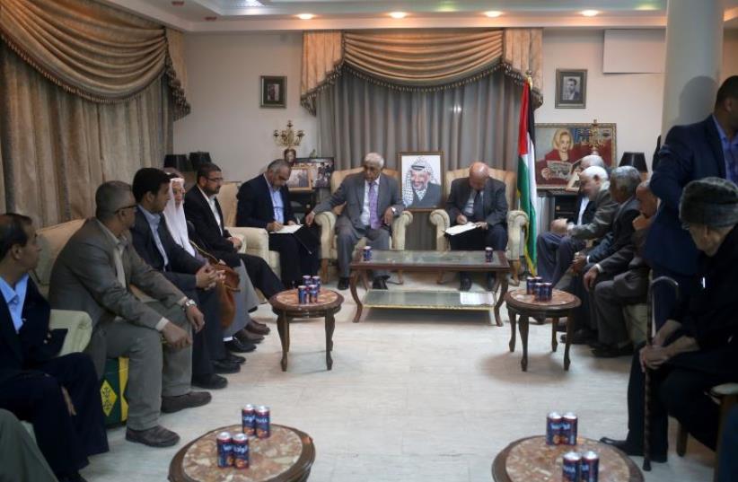 Palestinian politicians gather at the house of late Palestinian leader Yasser Arafat in Gaza City on November 10, 2015 (photo credit: MOHAMMED ABED / AFP)