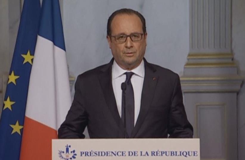 French President Francois Hollande makes a statement on television following attacks in Paris, France, in this still image taken from video on November 13, 2015. (photo credit: REUTERS)