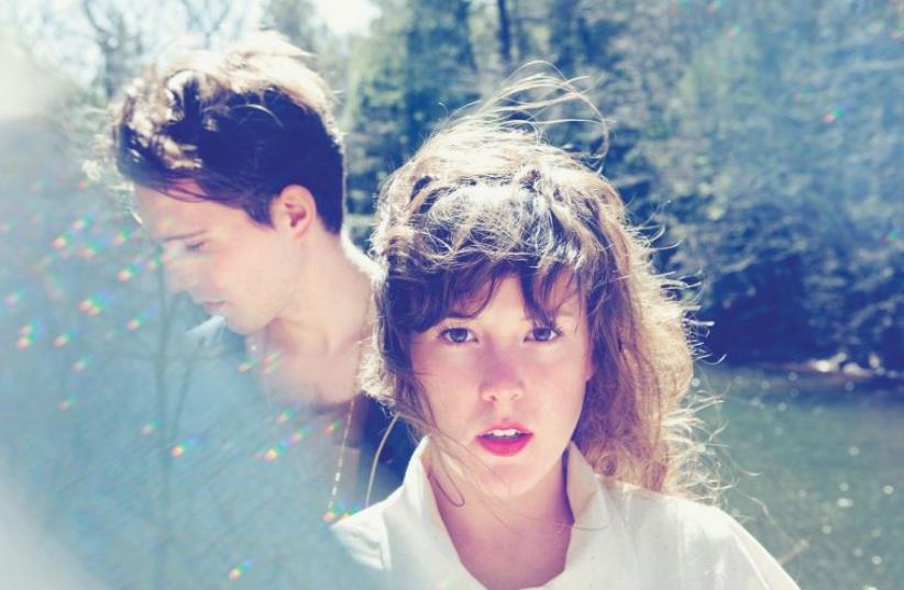 Purity Ring vocalist Megan James (right) with fellow band member Corin Roddick. (photo credit: Courtesy)