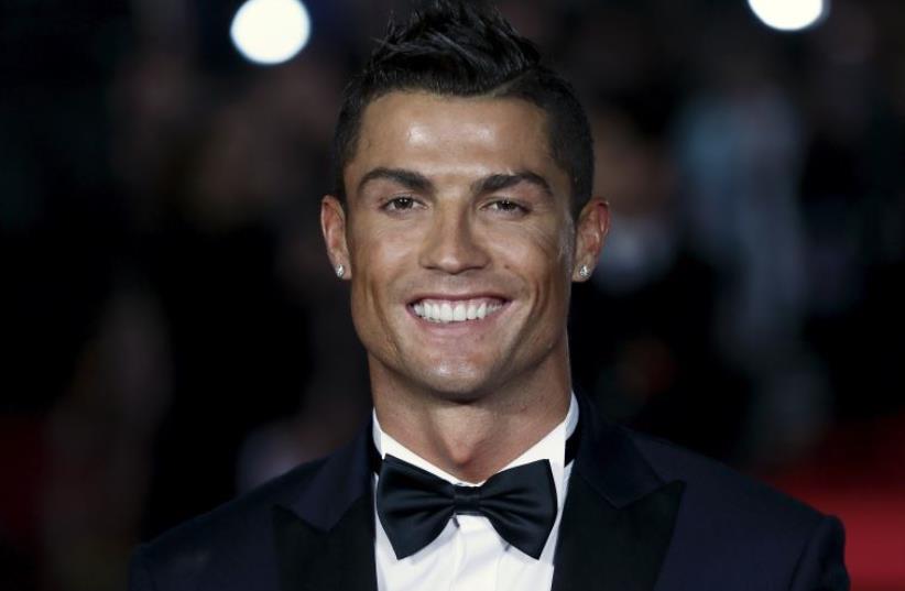 Cristiano Ronaldo on the red carpet at the world premiere of "Ronaldo" at Leicester Square in London, November 9, 2015 (photo credit: REUTERS)