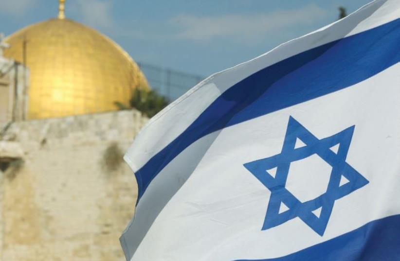 Israeli flag and Temple Mount  (photo credit: MARC ISRAEL SELLEM/THE JERUSALEM POST)