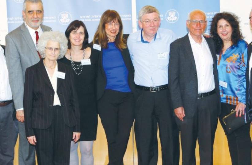Nili Cohen (fifth from right), president of the Israel Academy of Sciences and Humanities is surrounded by inductees into the academy (photo credit: SASSON TIRAM)