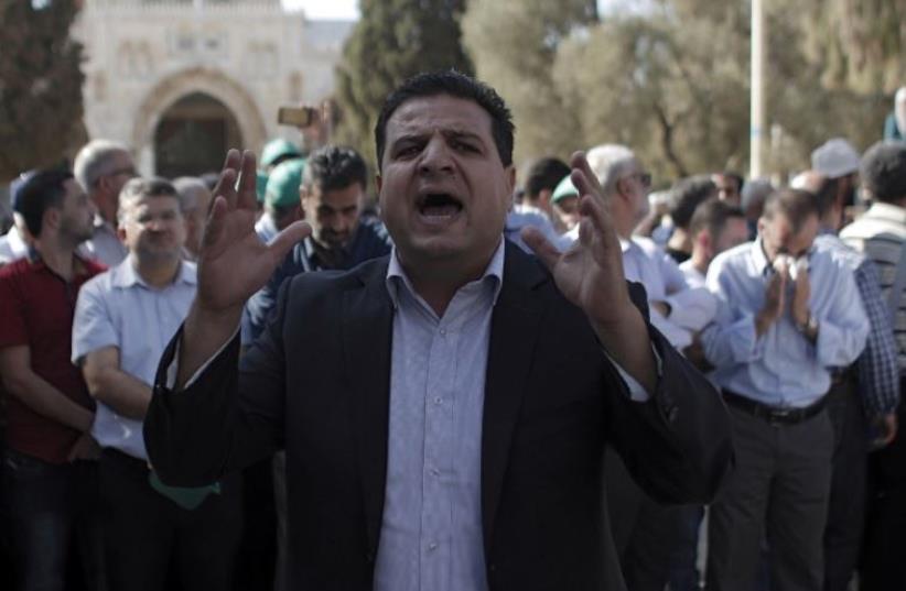 Joint List head Ayman Odeh shouts slogans near the Dome of the Rock in Jerusalem (photo credit: AFP PHOTO)